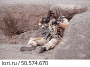Soldiers in camouflage military uniforms carrying weapons, Reconnaissance missions in rugged mountains, Assault infantry battle training. Стоковое фото, агентство Ingram Publishing / Фотобанк Лори