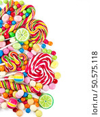 Colorful candies and lollipops isolated on a white background. Стоковое фото, агентство Ingram Publishing / Фотобанк Лори