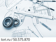 The plan industrial details, a protractor, caliper, divider and bearing. A photo closeup. Blue toning. Стоковое фото, агентство Ingram Publishing / Фотобанк Лори