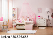 Room for young girl with pink decorations and bed. Стоковое фото, агентство Ingram Publishing / Фотобанк Лори