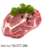 Raw pork neck chop meat with parsley herb leaves and peppercorn spices garnish isolated on white background cutout. Стоковое фото, агентство Ingram Publishing / Фотобанк Лори