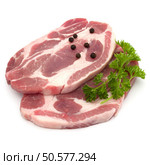 Raw pork neck chop meat with parsley herb leaves and peppercorn spices garnish isolated on white background cutout. Стоковое фото, агентство Ingram Publishing / Фотобанк Лори