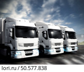 Three white articulated trucks on the road. Articulated trucks. Стоковое фото, агентство Ingram Publishing / Фотобанк Лори