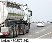 Container on the big highway. transport loads. Стоковое фото, агентство Ingram Publishing / Фотобанк Лори