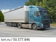 Container on the big highway. transport loads. Стоковое фото, агентство Ingram Publishing / Фотобанк Лори