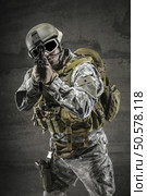 Soldier pointing gun at you. Стоковое фото, агентство Ingram Publishing / Фотобанк Лори