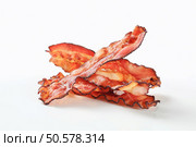 Crispy pan-fried strips of bacon. Стоковое фото, агентство Ingram Publishing / Фотобанк Лори
