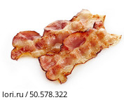 fried bacon strips on a white background. Стоковое фото, агентство Ingram Publishing / Фотобанк Лори