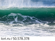 Detailed big green breaking sea wave. Northern portuguese coast in a stormy but sunny day. Стоковое фото, агентство Ingram Publishing / Фотобанк Лори