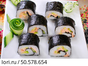 japanese maki sushi rolls set with salmon and avocado. Стоковое фото, агентство Ingram Publishing / Фотобанк Лори