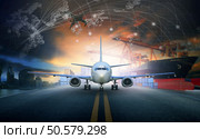 ship loading container in import - export pier and air cargo plane approach in airport use for transport and freight logistic business industry background. Стоковое фото, агентство Ingram Publishing / Фотобанк Лори