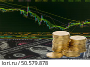 Coins and dollars on background stock ticker. Digital collage. Стоковое фото, агентство Ingram Publishing / Фотобанк Лори
