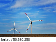 Windmills in the evening in Poland. Windmills at dusk. Стоковое фото, агентство Ingram Publishing / Фотобанк Лори