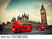 London, the UK. Red bus in motion and Big Ben, the Palace of Westminster. The icons of England in vintage, retro style. Стоковое фото, агентство Ingram Publishing / Фотобанк Лори