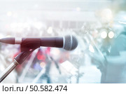 Abstract microphone with guitarist on stage, pastel color and soft concept. Стоковое фото, агентство Ingram Publishing / Фотобанк Лори