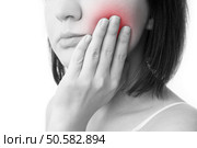 Toothache. Woman’s face isolated white background. Стоковое фото, агентство Ingram Publishing / Фотобанк Лори