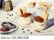 Tiramisu in a glass cup, selective focus. Стоковое фото, агентство Ingram Publishing / Фотобанк Лори