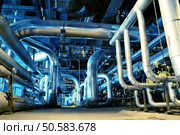 Pipes, tubes, machinery and steam turbine at a power plant  . Стоковое фото, агентство Ingram Publishing / Фотобанк Лори