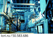 Pipes, tubes, machinery and steam turbine at a power plant           . Стоковое фото, агентство Ingram Publishing / Фотобанк Лори