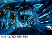 Pipes, tubes, machinery and steam turbine at a power plant             . Стоковое фото, агентство Ingram Publishing / Фотобанк Лори