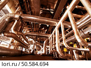 Pipes, tubes, machinery and steam turbine at a power plant            . Стоковое фото, агентство Ingram Publishing / Фотобанк Лори
