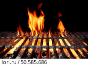 Hot Empty Charcoal BBQ Grill With Bright Flames On The Black Background. Cookout Concept. Стоковое фото, агентство Ingram Publishing / Фотобанк Лори
