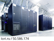 room with rows of server hardware in the data center. Стоковое фото, агентство Ingram Publishing / Фотобанк Лори