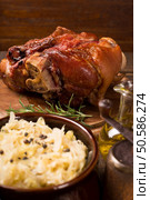 Baked pork shank with sauerkraut. Стоковое фото, агентство Ingram Publishing / Фотобанк Лори