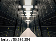 Image presents a room equipped with data servers. Yellow LED lights are flashing. Image can represent cloud computing, information storage, etc. or can be the perfect technology background. . Стоковое фото, агентство Ingram Publishing / Фотобанк Лори