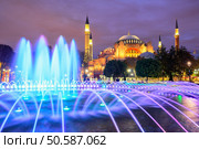 Beautiful Hagia Sophia in Istanbul old town with blue illuminated fountain, Sultanahmet district, Turkey. Стоковое фото, агентство Ingram Publishing / Фотобанк Лори