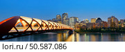Calgary cityscape with Peace Bridge and downtown skyscrapers in Alberta at night, Canada. Стоковое фото, агентство Ingram Publishing / Фотобанк Лори