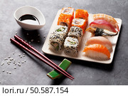Set of sushi and maki roll on stone table. Стоковое фото, агентство Ingram Publishing / Фотобанк Лори