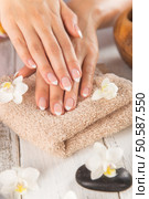 Woman with beautiful manicured nails in spa.. Woman with beautiful manicured nails. Стоковое фото, агентство Ingram Publishing / Фотобанк Лори