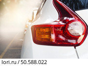 Back light of modern car on the street background . Стоковое фото, агентство Ingram Publishing / Фотобанк Лори