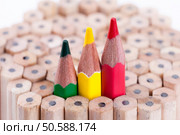 three sharpened green,yellow,red pencil among many ones. Стоковое фото, агентство Ingram Publishing / Фотобанк Лори