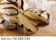 Set of cold cuts on a wooden board. Mix of sausages. Стоковое фото, агентство Ingram Publishing / Фотобанк Лори