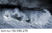 Big Atlantic wave over Portuguese cost. Enhanced sky. toned blue. Стоковое фото, агентство Ingram Publishing / Фотобанк Лори