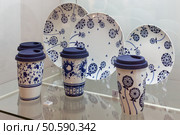 Moscow, Russia - March 1, 2025: The exhibition of the famous Russian brand Gzhel is the production of tableware and other ceramic products. Редакционное фото, фотограф Татьяна Васильева / Фотобанк Лори