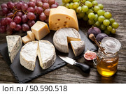 Assortment of cheese with fruits and grapes. French soft cheese. Стоковое фото, агентство Ingram Publishing / Фотобанк Лори