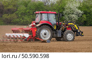 Small scale farming with tractor and plow in field. Agricultural landscape. Стоковое фото, агентство Ingram Publishing / Фотобанк Лори