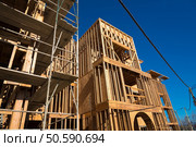 Wooden framing for construction of new condominiums, apartments or townhomes. Стоковое фото, агентство Ingram Publishing / Фотобанк Лори