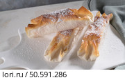 Typical portuguese sweets Pasteis de Vouzela served on countertop. Стоковое фото, агентство Ingram Publishing / Фотобанк Лори