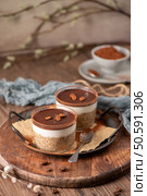Delight in a luscious tiramisu-inspired chia pudding, layered with creamy coffee-infused chia and a rich chocolate topping. A guilt-free breakfast or dessert that marries classic flavors with wholesome ingredients for a convenient and satisfying treat. Стоковое фото, агентство Ingram Publishing / Фотобанк Лори
