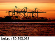 Cargo ship at sunset time in beautiful colours. Стоковое фото, агентство Ingram Publishing / Фотобанк Лори