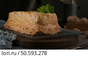 Golden caramelized meringue dessert, a classic molotof or molotov, garnished with fresh mint leaves on a rectangular plate, inviting and delicious. Стоковое фото, агентство Ingram Publishing / Фотобанк Лори