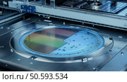 Semiconductor Wafer after Dicing Process. Silicon Dies are Being Extracted by Pick and Place Machine. Computer Chip Manufacturing. Packaging Process. Стоковое фото, агентство Ingram Publishing / Фотобанк Лори
