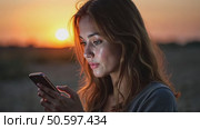Beautiful young woman use smartphone at night. Millennial generation z female scroll through news feed on app on her phone. Cinematic film look photo of pretty girl. Стоковое AI-видео, аниматор Sergey Grishin / Фотобанк Лори