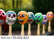 Colorful calaveras skulls celebrating day of the dead festivities. Стоковое AI-изображение, AI-художник Иван Рябоконь / Фотобанк Лори