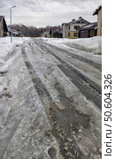 Spring thaw. Snow-covered, uncleared road in a siberian cottage village Sigma. Стоковое фото, фотограф Сергей Пристяжнюк (Serg Zastavkin) / Фотобанк Лори