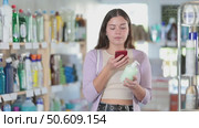 Young woman scanning qr code for liquid soap. Стоковое видео, видеограф Яков Филимонов / Фотобанк Лори